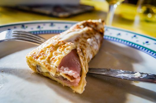 French crepe picarde with ham, mushroom and sauce bechamel