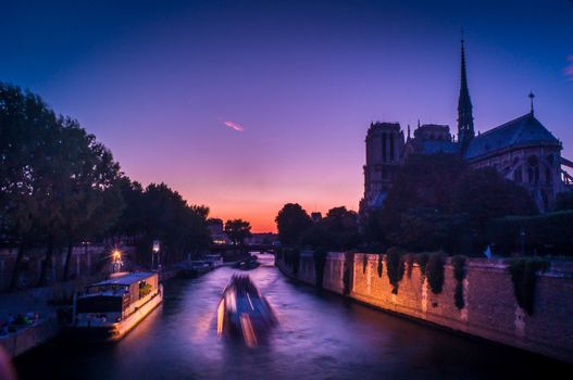 Purple sunset at dusk over Paris and Notre Dame de Paris