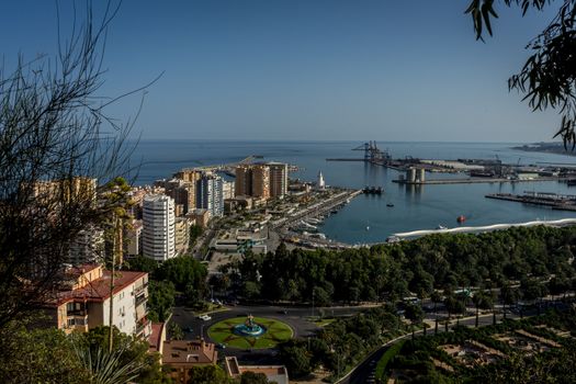 aerial view of Malagueta district and La Malagueta Harbour in Malaga, Spain, Europe on a bright summer day with blue sky