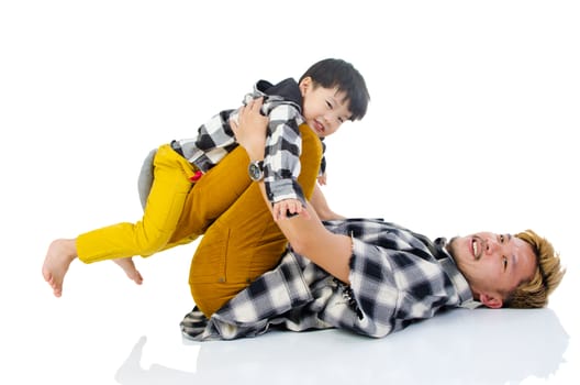 Happy Asian father playing with little boy