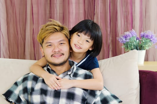 happy asian family in the living room