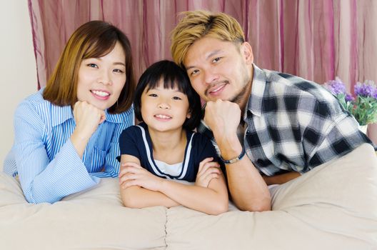 happy asian family in the living room