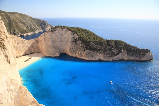 beautiful white beach with shipwreck in a greek island