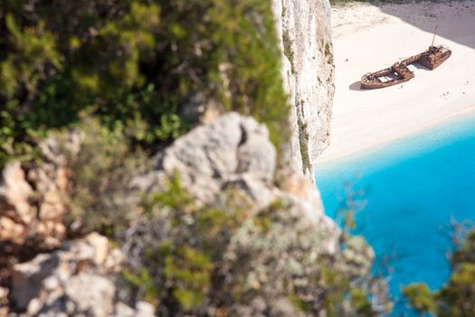 beautiful white beach with shipwreck in a greek island