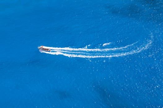 small ship travel in the blue sea 