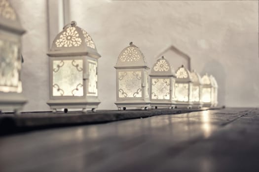 close up of beautiful white lanterns on a table of a restaurant