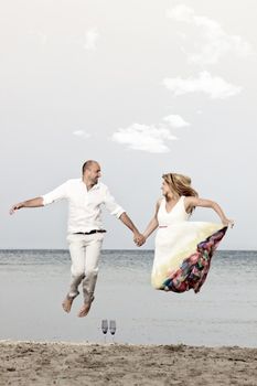 portrait of a young couple at the beach having romance
