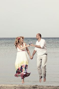 portrait of a young couple at the beach having romance
