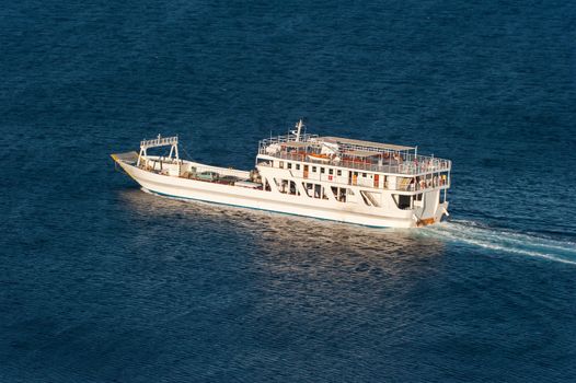 small ship transport cars and people in the greek sea