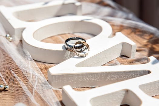 closeup of wedding rings with beautiful decoration