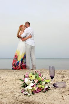 portrait of a young couple at the beach having romance
