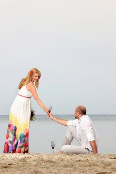 portrait of a young couple at the beach having romance
