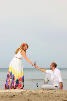 portrait of a young couple at the beach having romance
