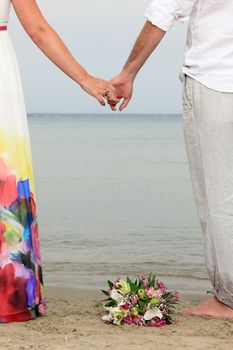 portrait of a young couple at the beach having romance
