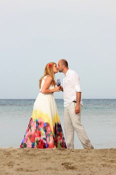 portrait of a young couple at the beach having romance
