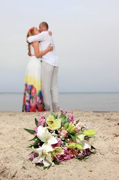 portrait of a young couple at the beach having romance

