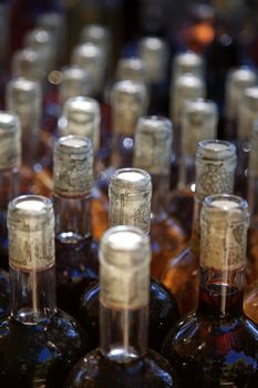 close up of bottles with wine  