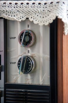 closeup of old tv tunning knobs