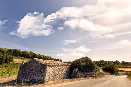 old stone house close to the road