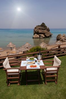 healthy seafood on a table for two by the sea