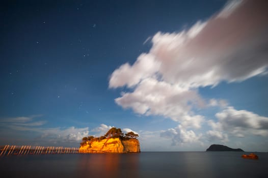 small island with bridge at night with clouds and moon light 