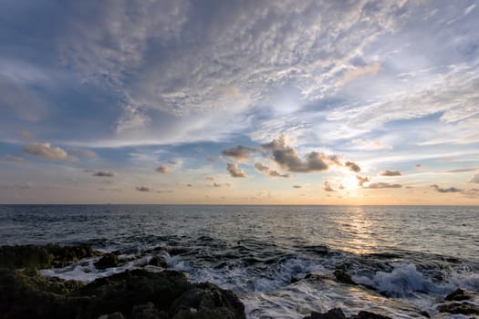 beautiful landscape with sunset at the sea with clouds