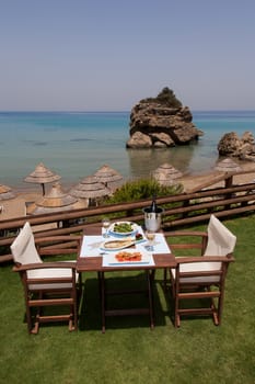 healthy seafood on a table for two by the sea