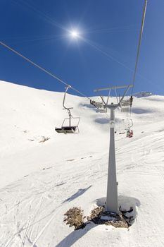 ski lift on the slope of a big ski resort