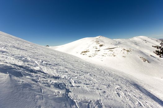 top of the mountain with snow on a sunny day