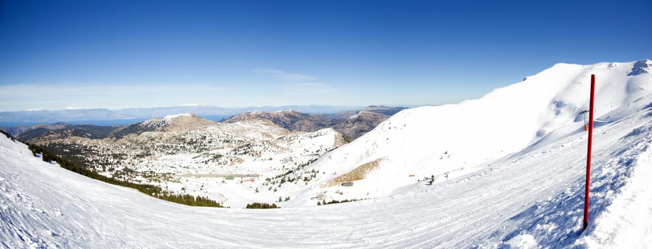 top of the mountain with snow on a sunny day