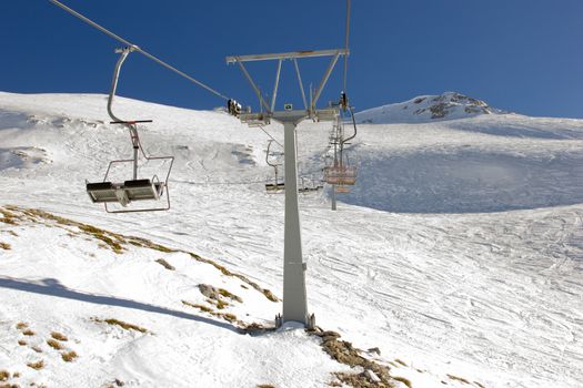 ski lift on the slope of a big ski resort in greece