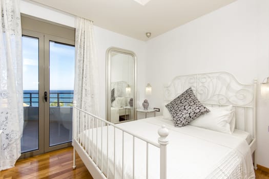 interior of a luxury bedroom with a beautiful sea view