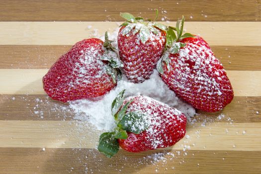 closeup of fresh strawberries with sugar powder on top 