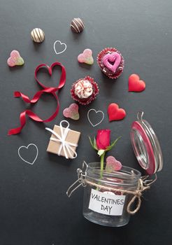 Jar of love treats including cupcakes, roses, hearts and chocolates