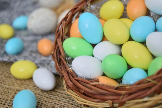 chocolate eggs of various colors with decorations