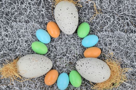 chocolate eggs of various colors with decorations