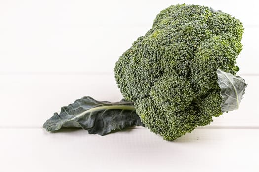 Fresh broccoli on white wooden table background