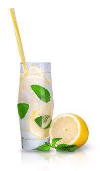 Lemonade with mint and ice. A sweaty glass with ice cubes and a tube for cocktails. Isolated on white background.