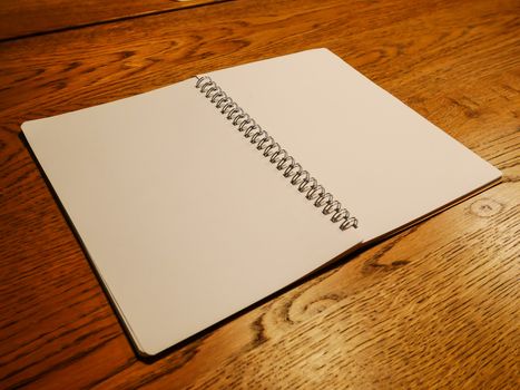 Sketch book on wooden table 