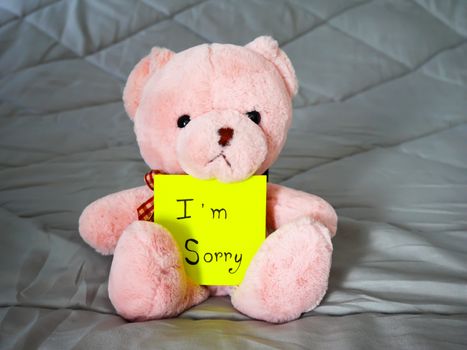 I'm sorry on post note with teddy doll on bed