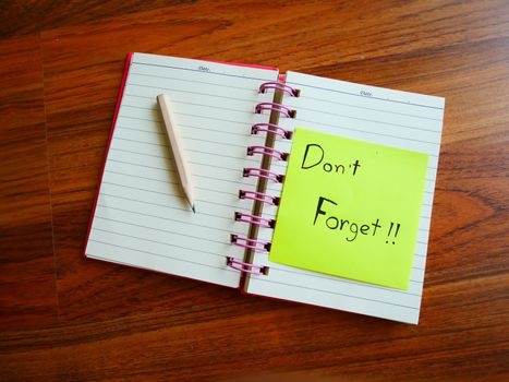 Don't forget post note with note book on top view