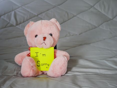 I'm sorry on post note with teddy doll on bed