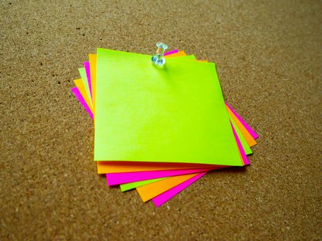 Colorful post it note on wood board