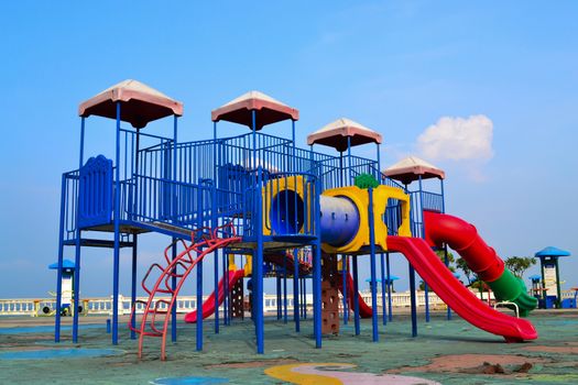Colorful playground on blue sky background