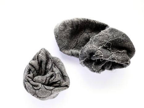 Used grey socks isolated on white background