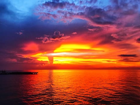 Beautiful sunset, cloud, dusk sky, silhouette and reflect on the sea