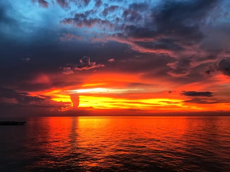 Beautiful sunset, cloud, dusk sky, silhouette and reflect on the sea