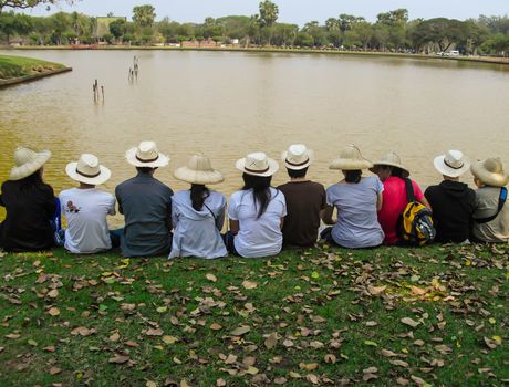 Asia teen group sitting and  looking view in park