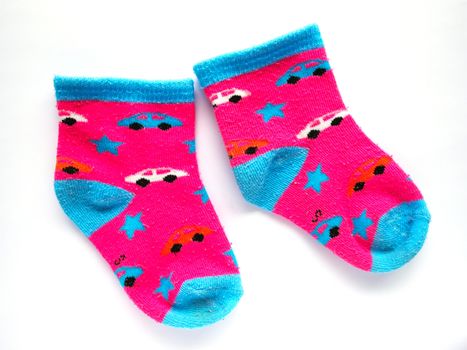 Pink kid socks isolated on white background