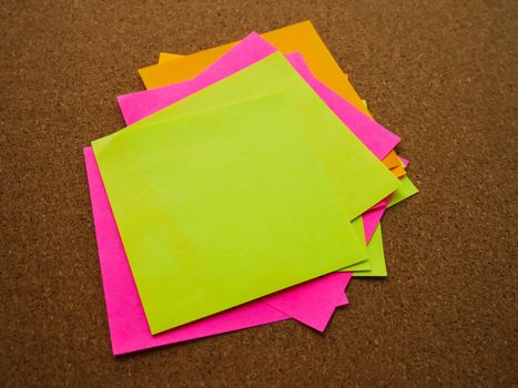 Many and colorful post note attach on wood board